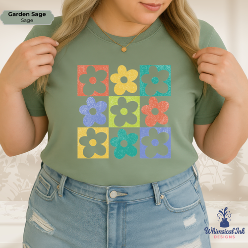 Person wearing a green t-shirt with colorful flower pattern and denim shorts on a light background