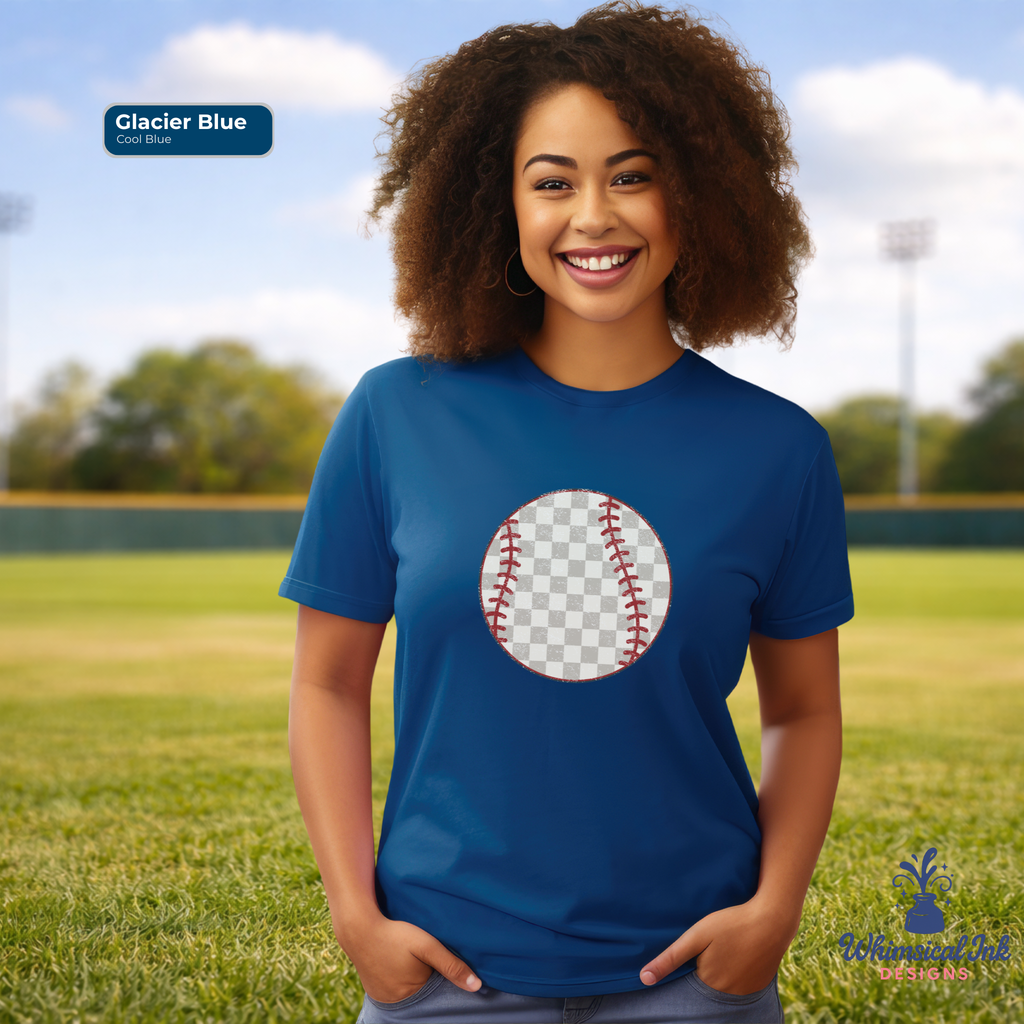 Woman wearing a blue t-shirt with a baseball graphic on a grassy field