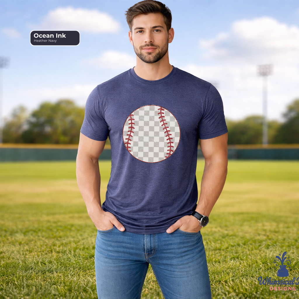 Man wearing a blue t-shirt with a baseball graphic on a grassy field