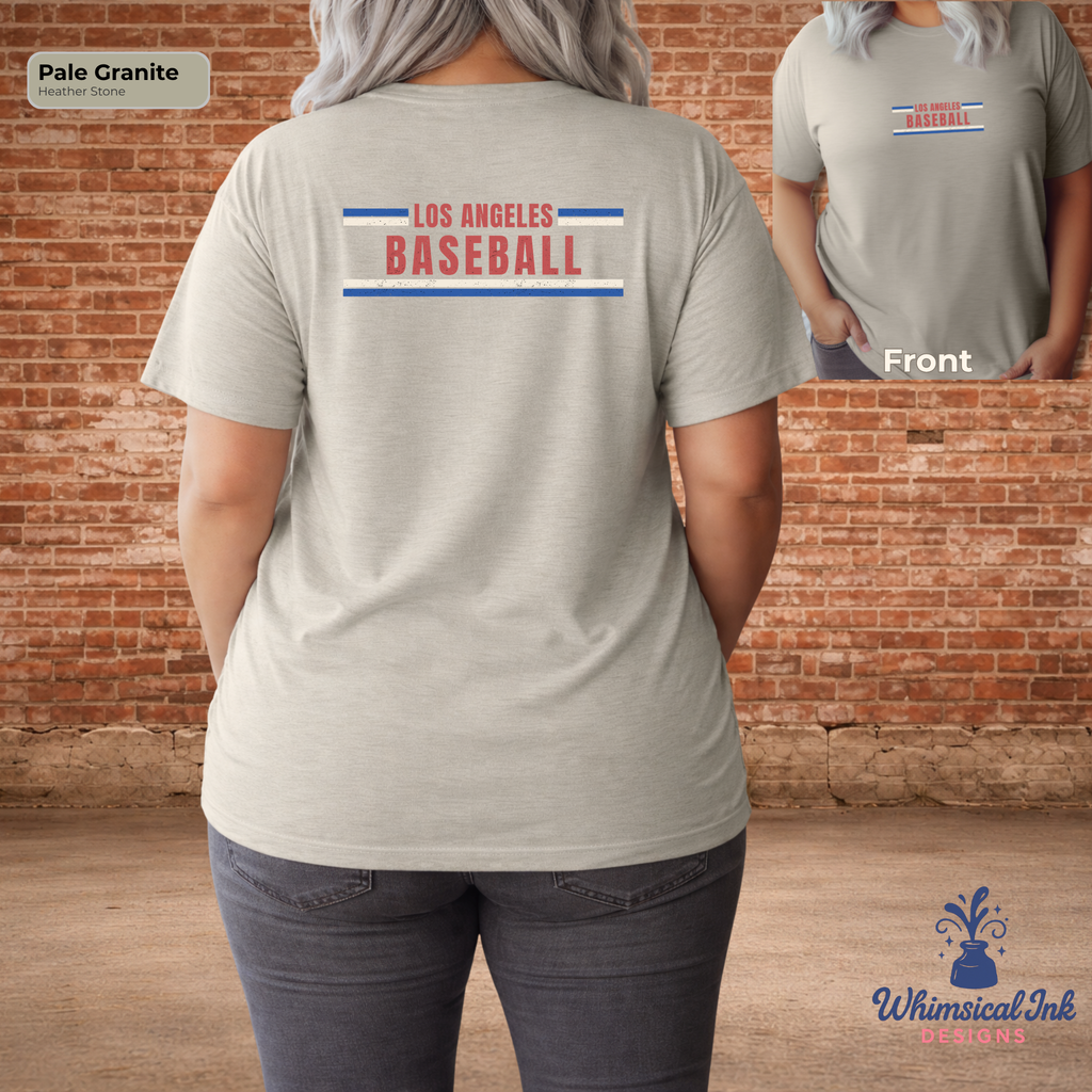 Person wearing a gray t-shirt with 'Los Angeles Baseball' text, standing in front of a brick wall.