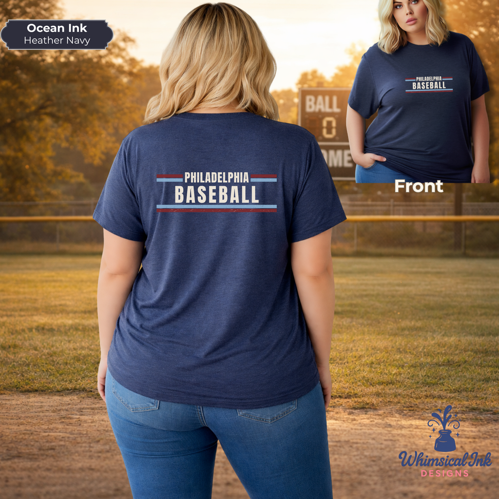 Person wearing a navy blue t-shirt with 'Philadelphia Baseball' text, standing on a baseball field.