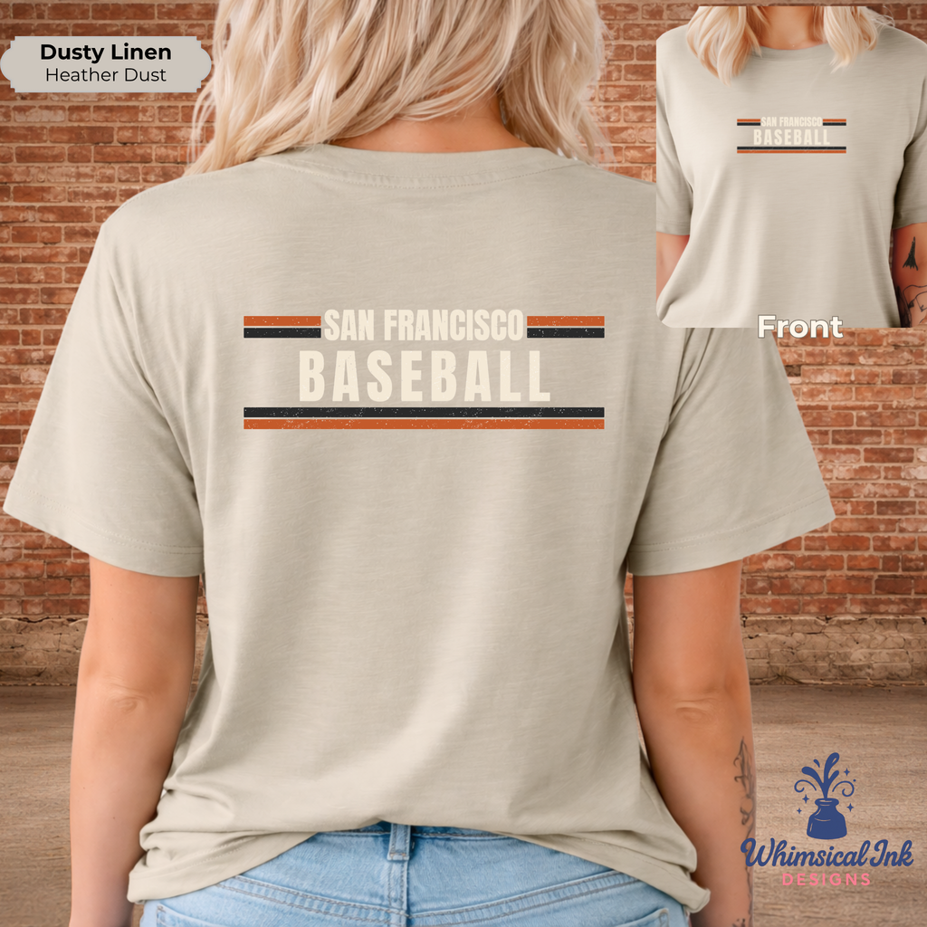 Person wearing a beige t-shirt with 'San Francisco Baseball' text and logo, standing against a brick wall.