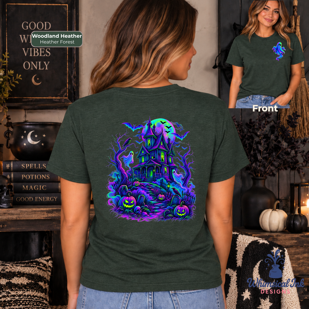 A woman wearing a heather forest green t-shirt, showing both the front and back views. The back of the shirt features a large, vibrant Halloween graphic with a haunted house, spooky tree, full moon, and pumpkins in neon purple, blue, and green.