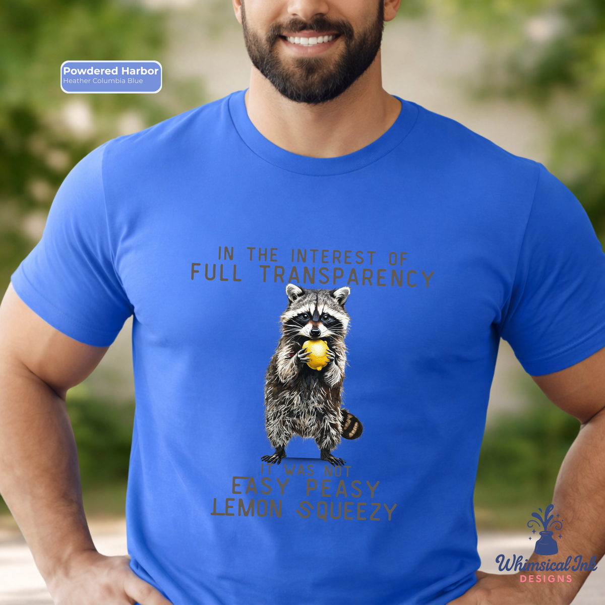 Person wearing a blue t-shirt with a raccoon graphic and humorous text.