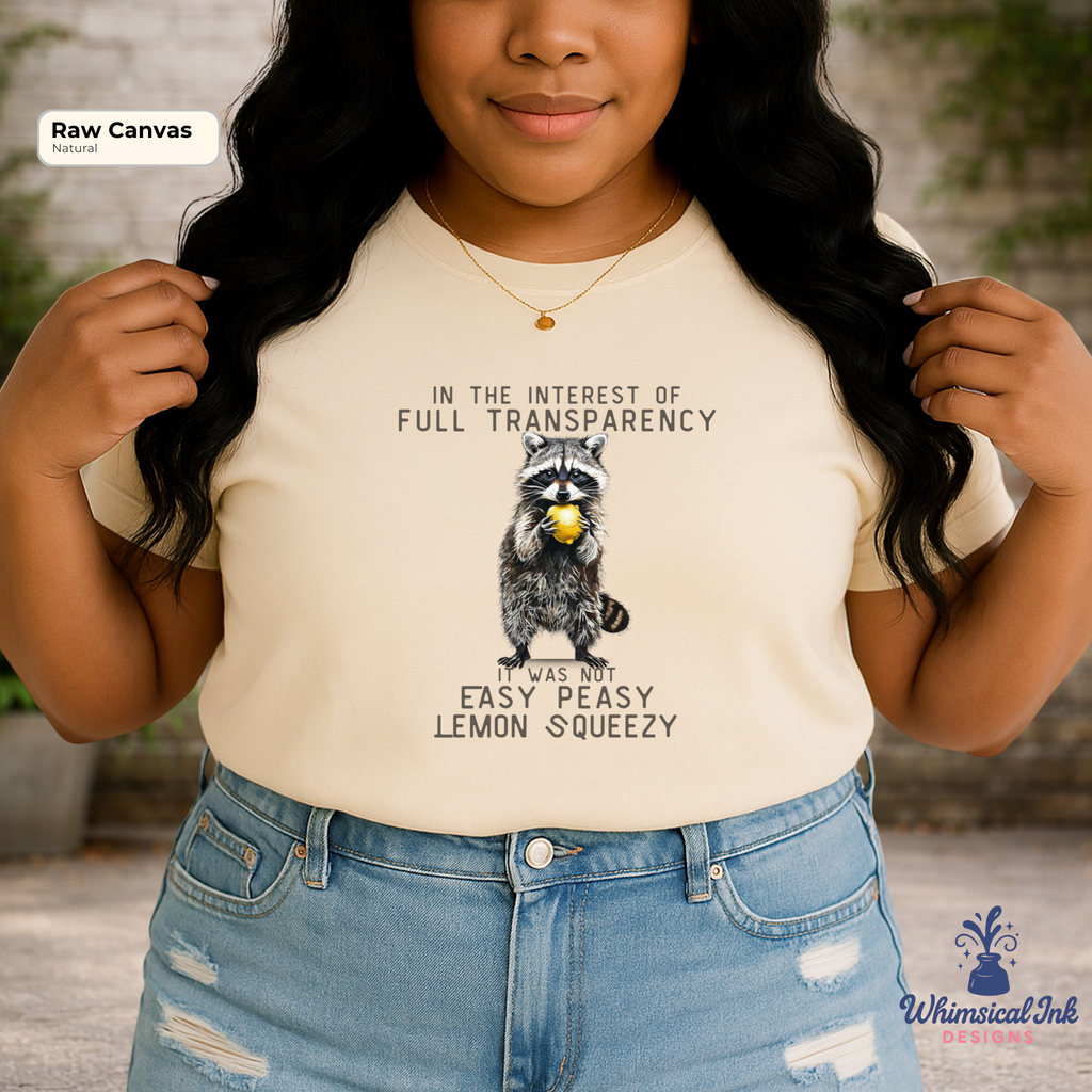 Person wearing a t-shirt with a raccoon graphic and humorous text, standing outdoors.