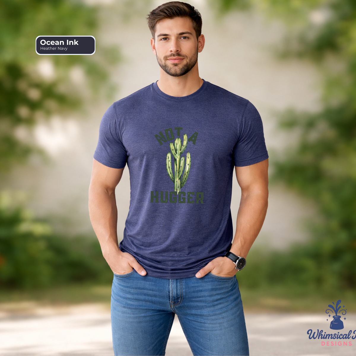 Man wearing a blue t-shirt with a cactus graphic and text, standing outdoors.