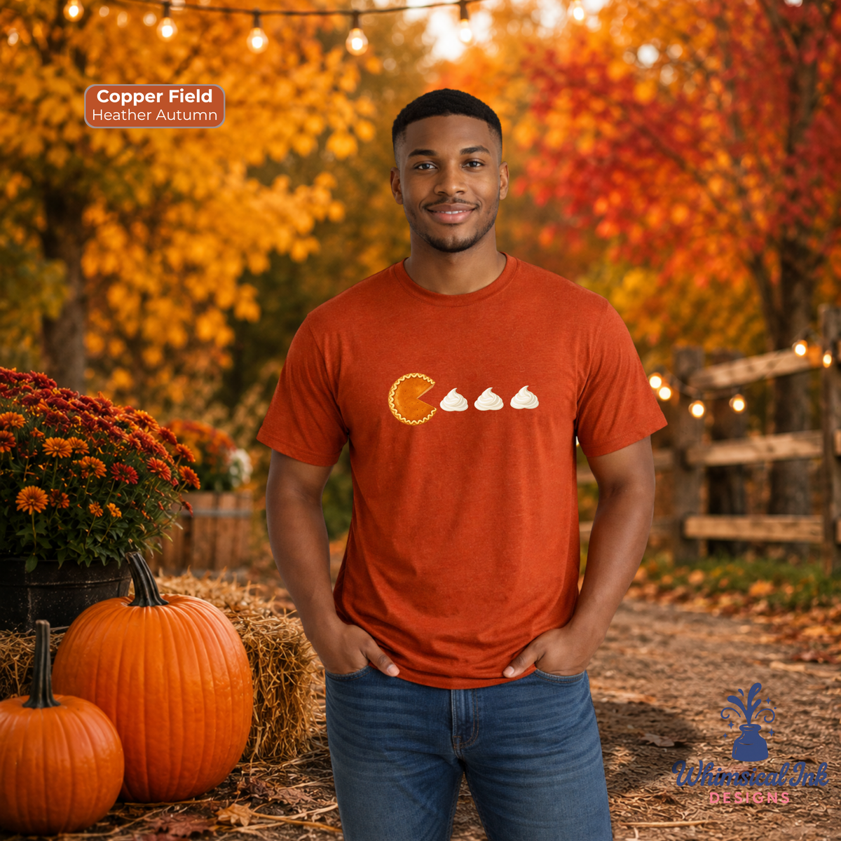 A man wearing a copper orange t-shirt with a graphic of a pumpkin pie and whipped cream, standing in an autumn-themed outdoor setting with pumpkins and fall foliage. Text overlays read 'Copper Field Heather Autumn' and 'Whimsical Ink Designs'