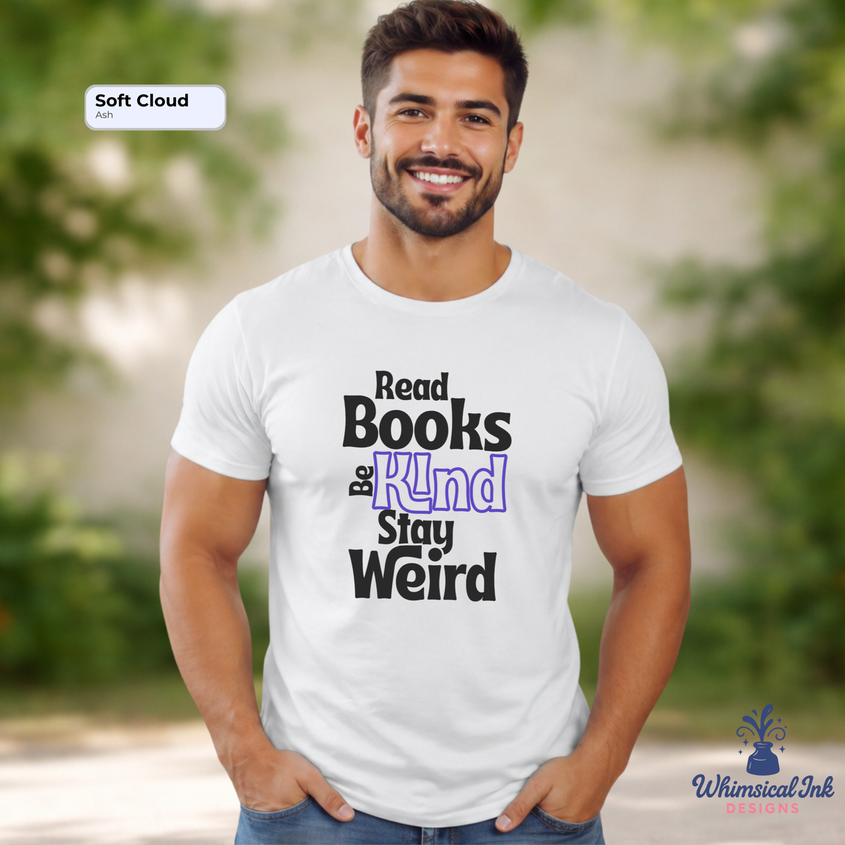 Man wearing a white t-shirt with text 'Read Books Be Kind, Stay Weird' in an outdoor setting.