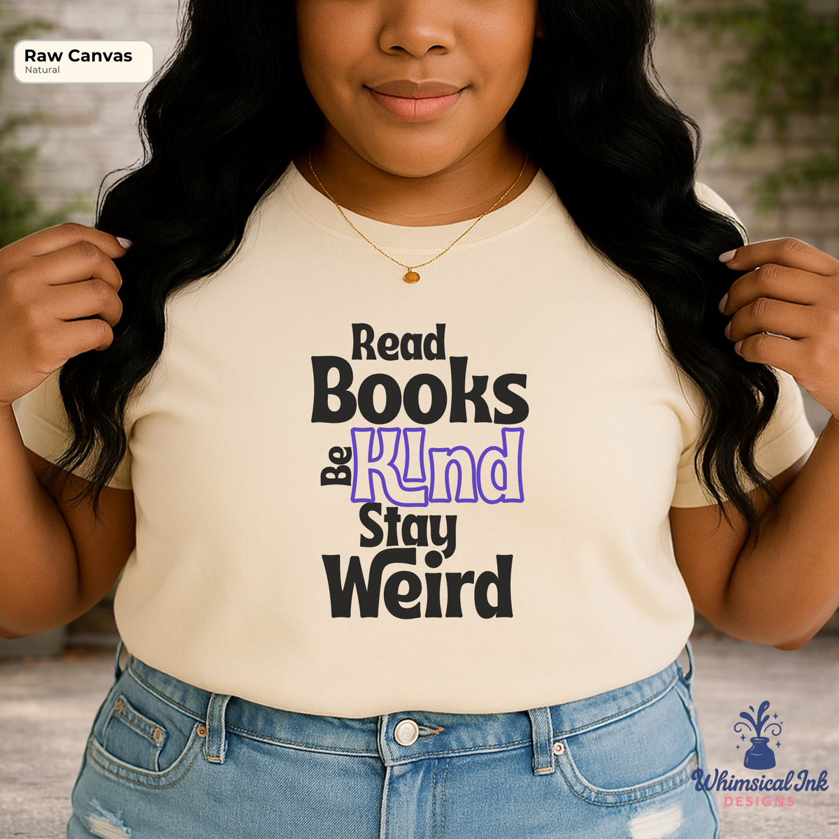 Person wearing a t-shirt with 'Read Books Be Kind Stay Weird' text, standing outdoors.